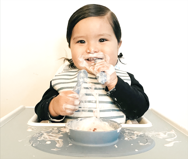 baby eating messy from ezpz bowl